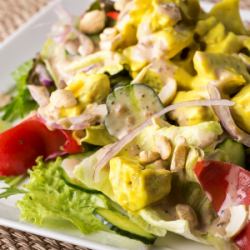 Caesar salad with thick-sliced bacon and avocado