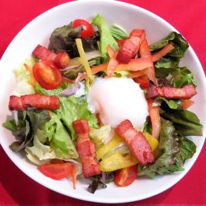 Caesar salad with soft-boiled egg and prosciutto