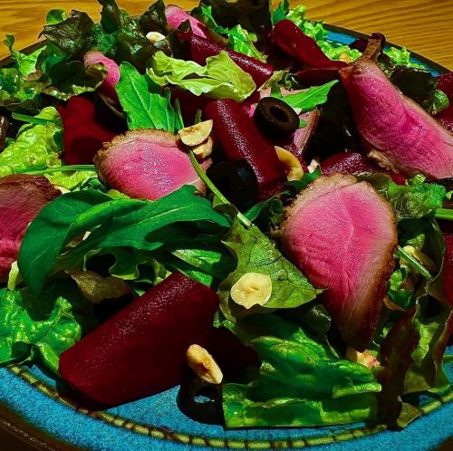 Homemade smoked duck salad with berry dressing