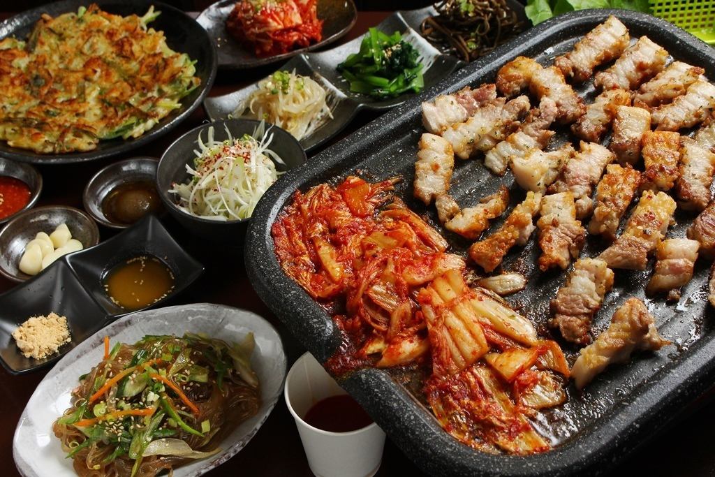 Enjoy authentic Korean food while being wrapped in the sound of roasting meat