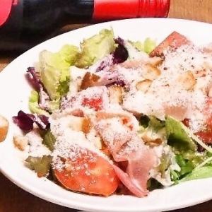 Caesar salad with soft-boiled egg and prosciutto