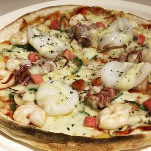 Seafood pizza with plenty of seafood