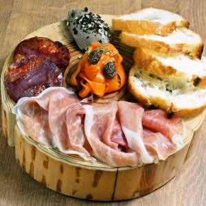 Assorted meat appetizers with baguette