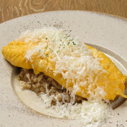 Japanese-style risotto with fragrant porcini mushrooms, served with a fluffy omelette