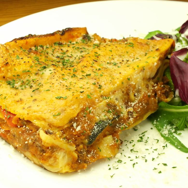 Homemade minced meat sauce and colorful vegetable lasagna