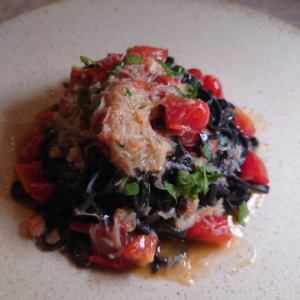 Snow crab and cherry tomato sauce, squid ink tagliolini