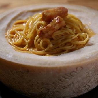 Rich carbonara made in a cheese bowl
