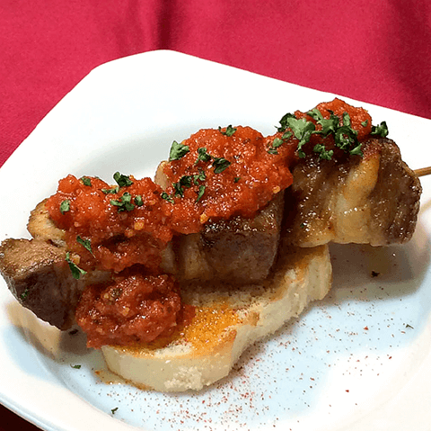 Moroccan-style spiced skewers of locally selected pork