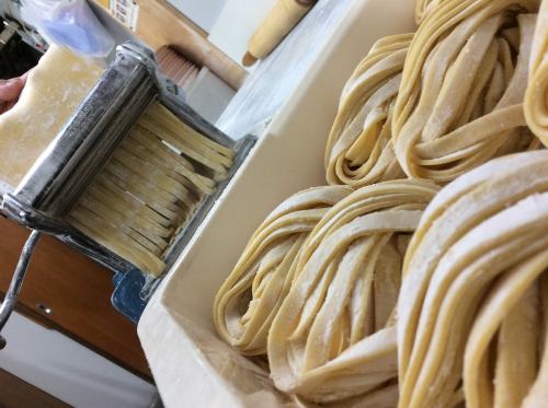 Raw pasta is made by hand every day