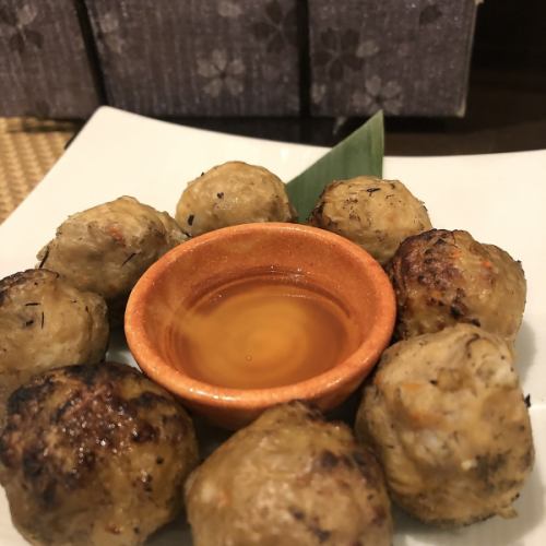 Grilled meatballs with straw