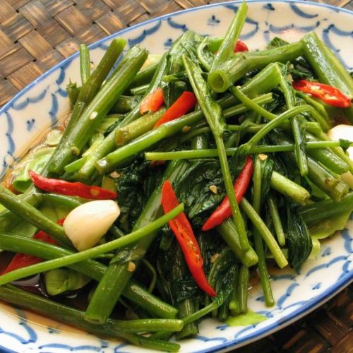 Stir-fried flaming spinach “Pakbun Fai Daeng”