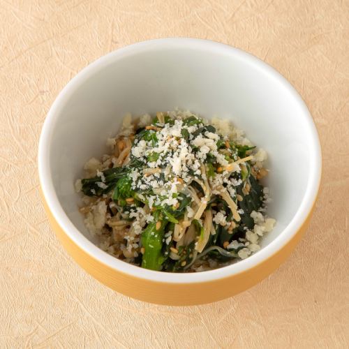 Parmigiano Reggiano and spinach with sesame seeds