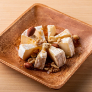 Camembert cheese and mixed nuts with maple syrup