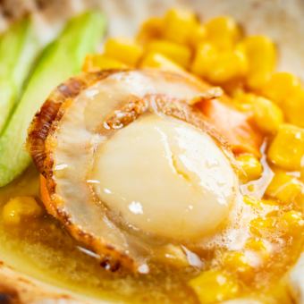 Grilled scallops in the shell with soy sauce and butter