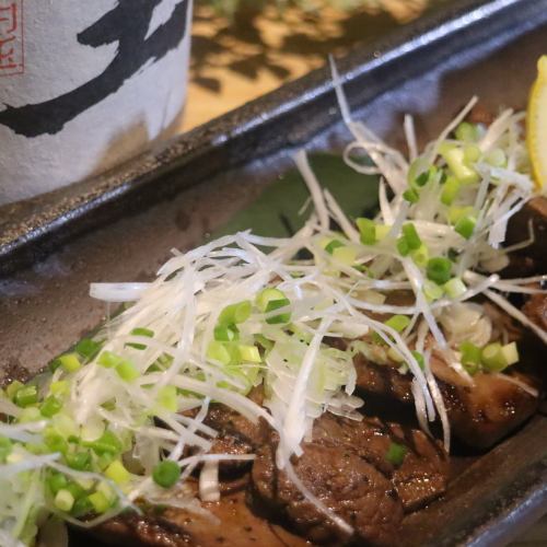 Grilled beef tongue steak with lots of green onions