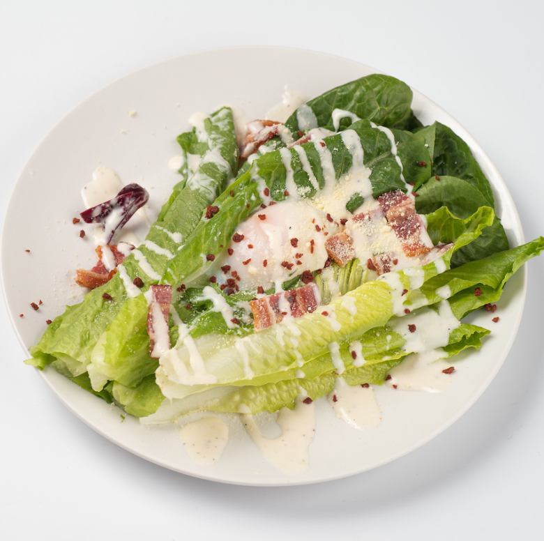 Caesar salad with romaine lettuce and crispy bacon