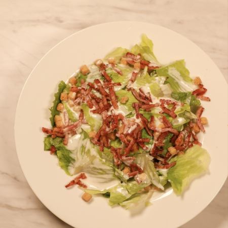 Caesar salad with crispy bacon and romaine lettuce