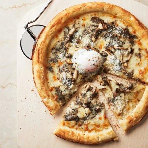 Soft-boiled egg and mushroom truffle cream pizza