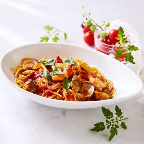 Pescatore with seafood and ripe tomatoes