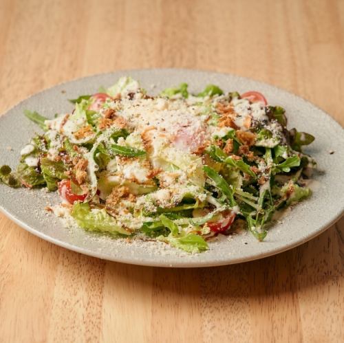 Caesar salad with two kinds of cheese "topped with hot egg"