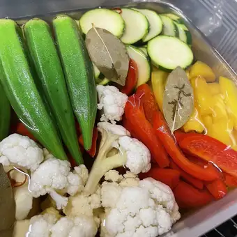 Colorful vegetable pickles in apple cider vinegar