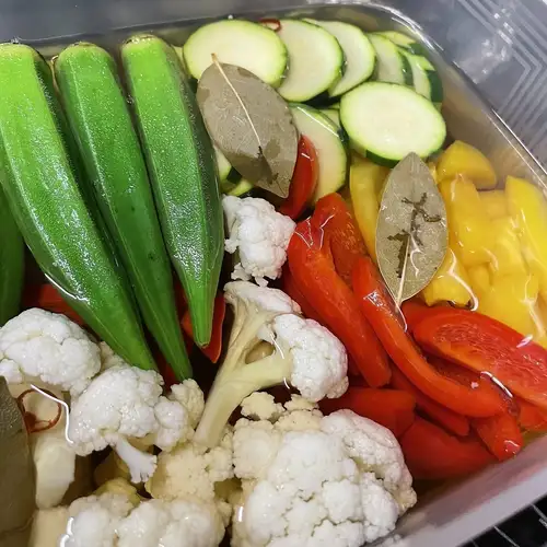 Colorful vegetable pickles in apple cider vinegar