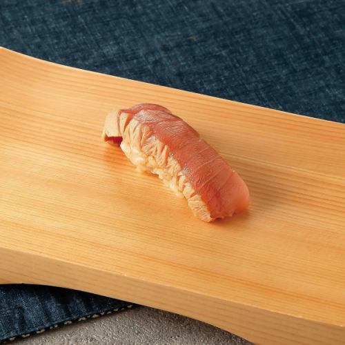 Seasonal nigiri sushi: 1 piece of fatty tuna marinated in soy sauce