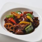 Sweet and sour pork with pork and root vegetables in black vinegar