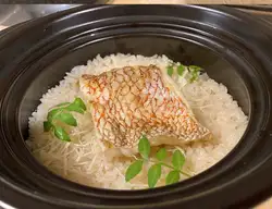 Natural sea bream rice cooked in an earthenware pot