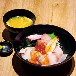 Bowl of rice topped with sashimi