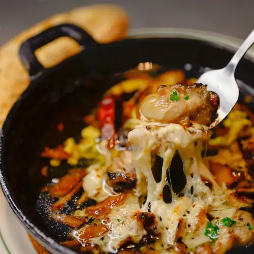 Oyster and mushroom ajillo (served with 2 slices of baguette)