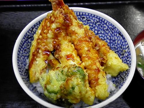 Bowl of rice and fried fish