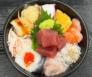 Bowl of rice topped with sashimi