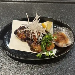 Grilled Pacific saury from Iwate Prefecture with aromatic herbs.
