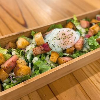 Caesar salad with homemade croutons and soft-boiled eggs