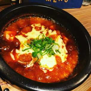 Mapo tofu topped with cheese