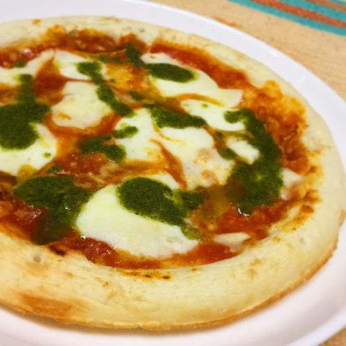 Mozzarella cheese, basil and tomato sauce pizza