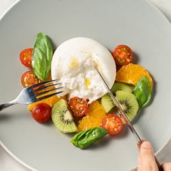 Burrata cheese, fruit and tomato caprese