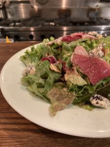 Salad of duck ham, seasonal fruits, blue cheese and nuts