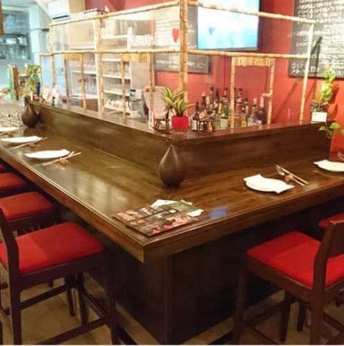 The counter seats are bar style with red as the base color.