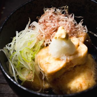 Deep-fried tofu in broth at a soba restaurant