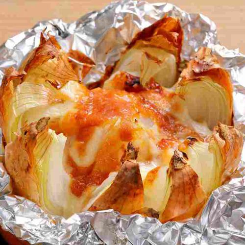 Grilled whole onion with garlic, miso and cheese