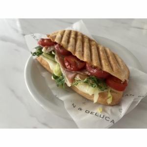 Prosciutto, mozzarella and tomato hot sandwich