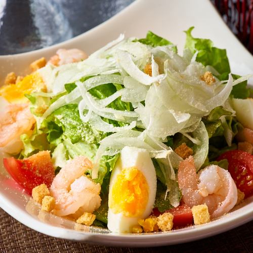 Caesar salad with shrimp and egg