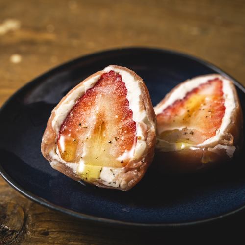 Strawberries and cheese wrapped in prosciutto