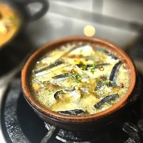 秋刀魚と蕾椎茸のアヒージョ