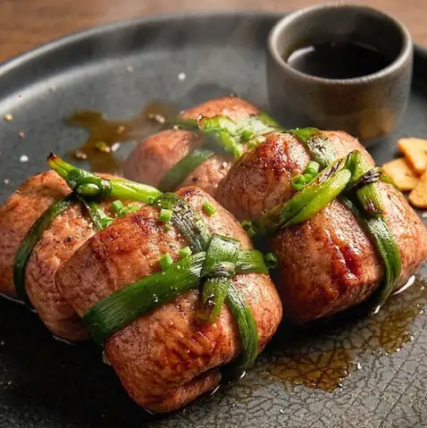 Meat-wrapped salmon roe gunkan sushi