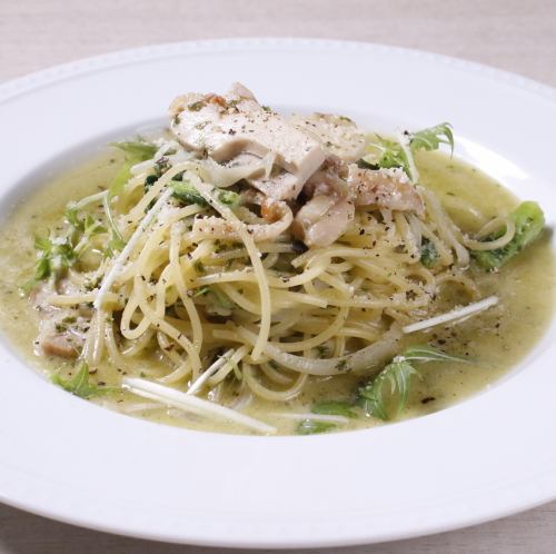 Fresh pasta with chicken and local vegetables in a basil cream sauce