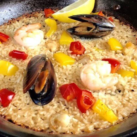 Paella cooked from raw rice