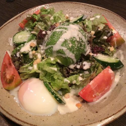 Caesar salad with hot spring egg and avocado